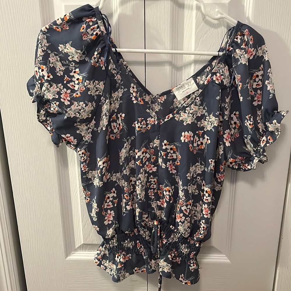 blue tshirt blouse with white and pink flowers